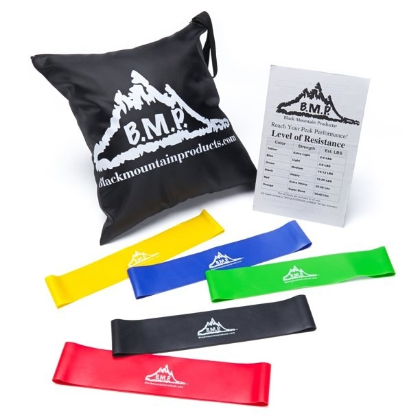 five different colored resistance bands with a black bag and guide