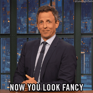 Seth Meyers sitting behind a desk saying, &quot;Now you look fancy&quot;