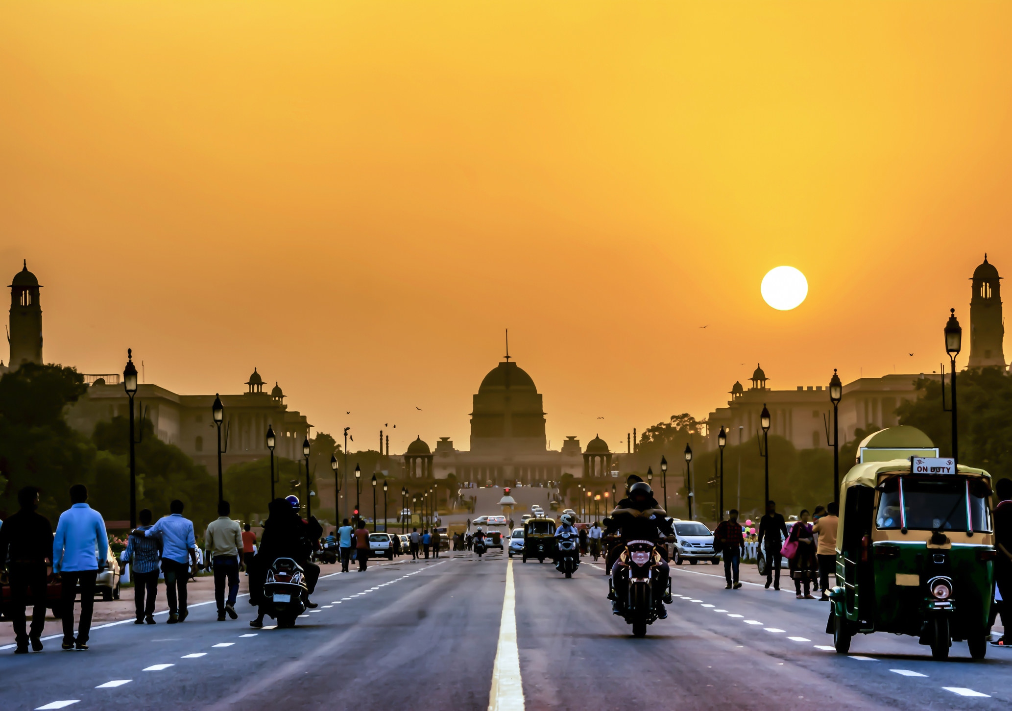 A busy street in India during sunset