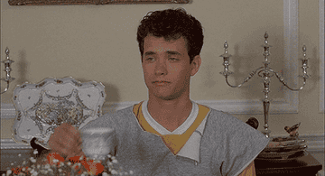 Tom Hanks sipping tea with his pinky up