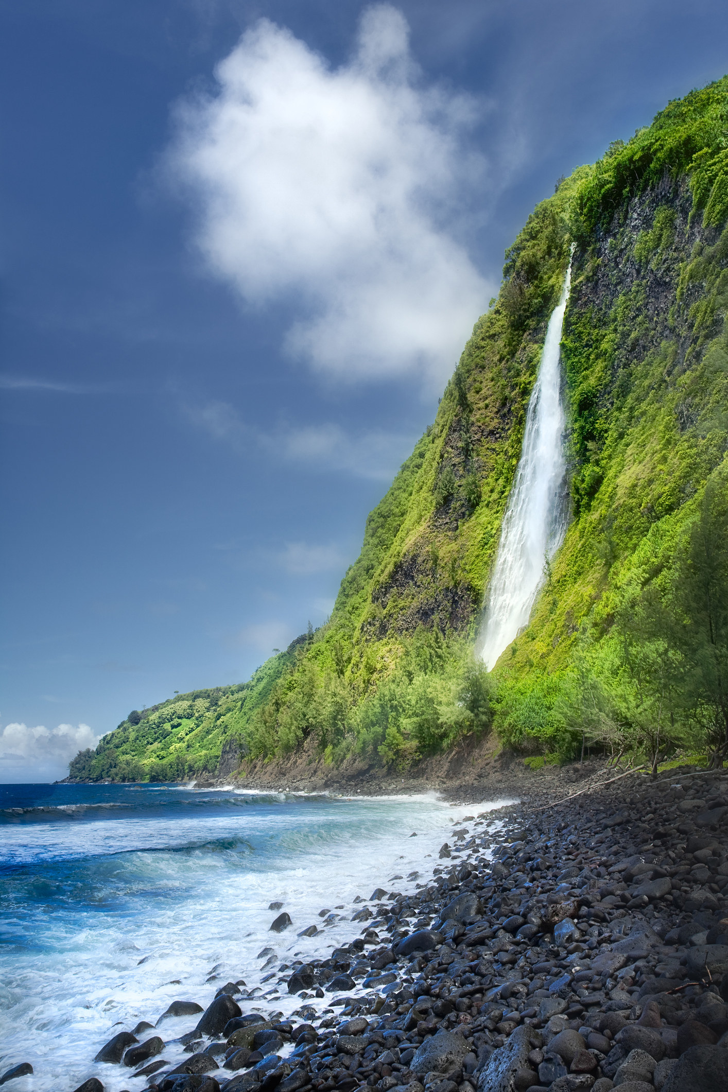 A waterfall against the ocean in Hawaii