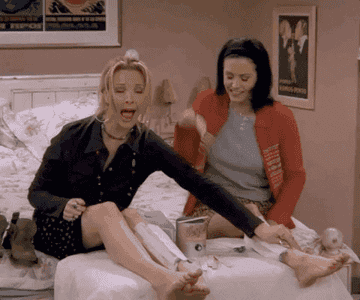 Monica and Phoebe from &quot;Friends&quot; waxing each other&#x27;s legs