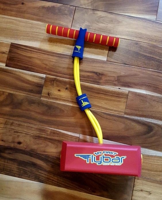 reviewer&#x27;s picture of the foam pogo jumper in red and yellow
