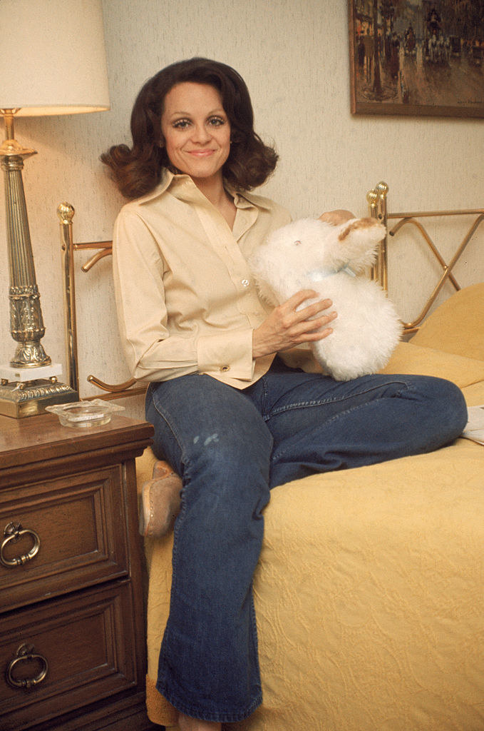 Valerie Harper holding a stuffed animal.