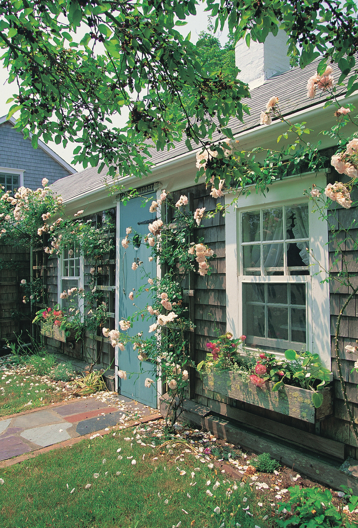 A quaint house covered in flowers in Nantucket