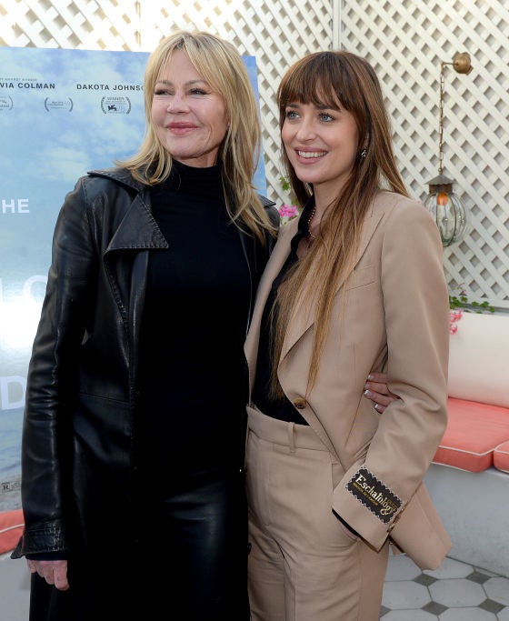 the two pose at an event