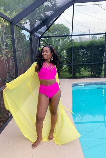 a reviewer wearing the bathing suit in pink