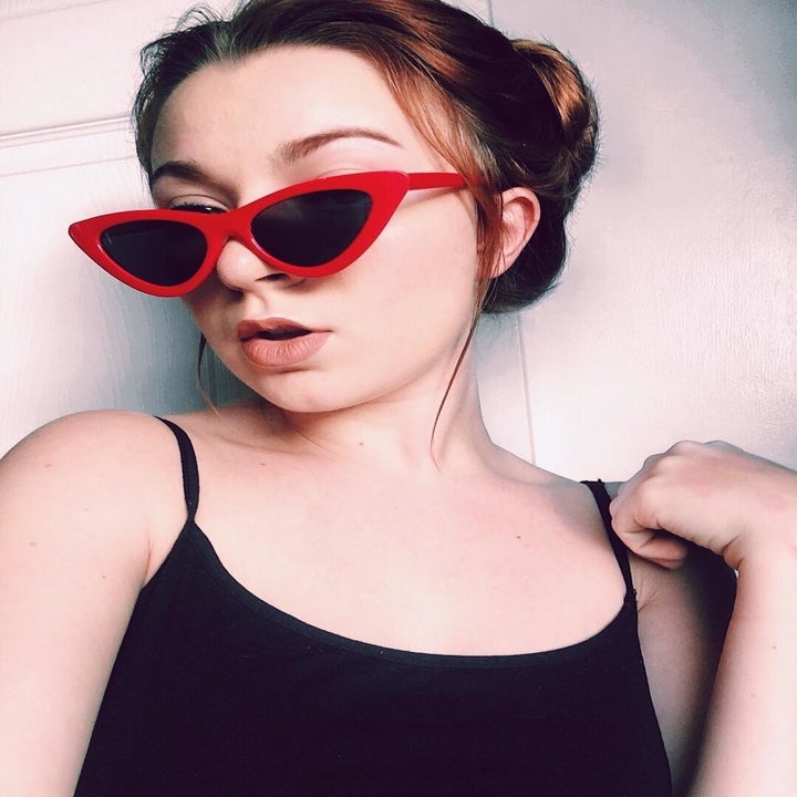 model wearing the red glasses
