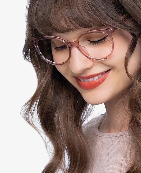 model wearing clear pink glasses