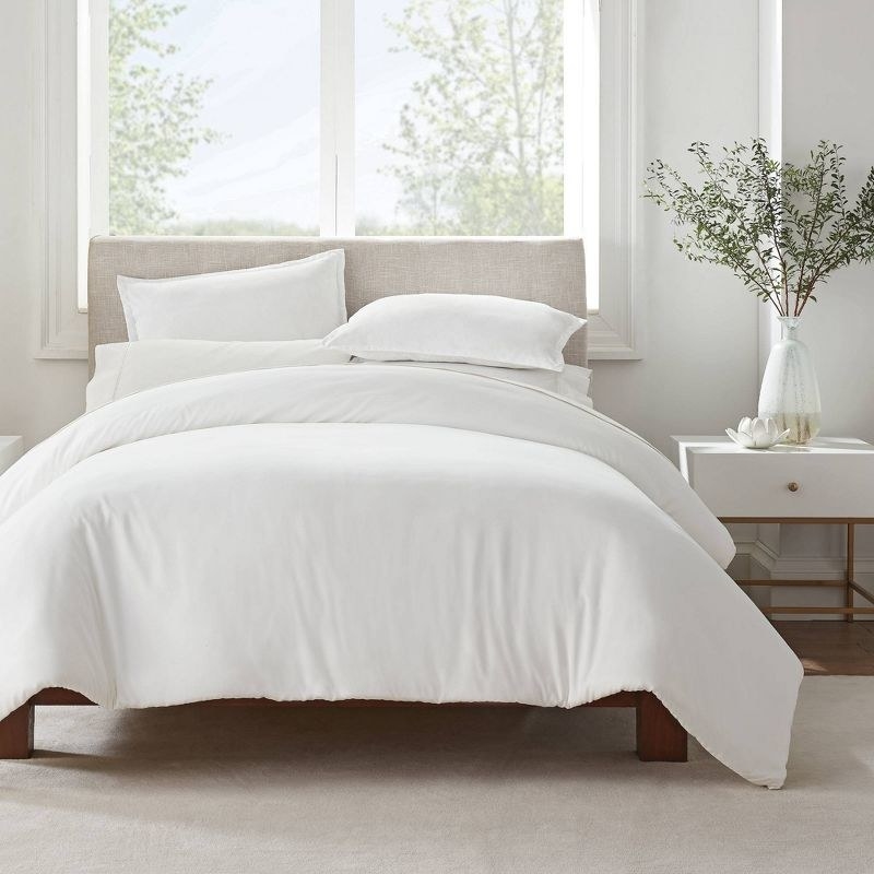 A bed made up with the white bedding