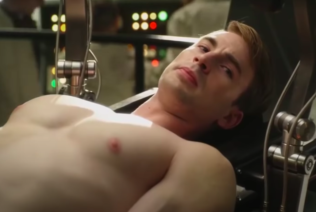 A buff Chris Evans lying on a table after getting injected with super serum