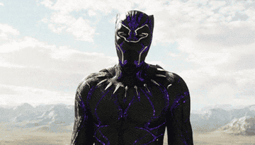 Chadwick Boseman as T&#x27;Challa reveals his face under the Black Panther suit