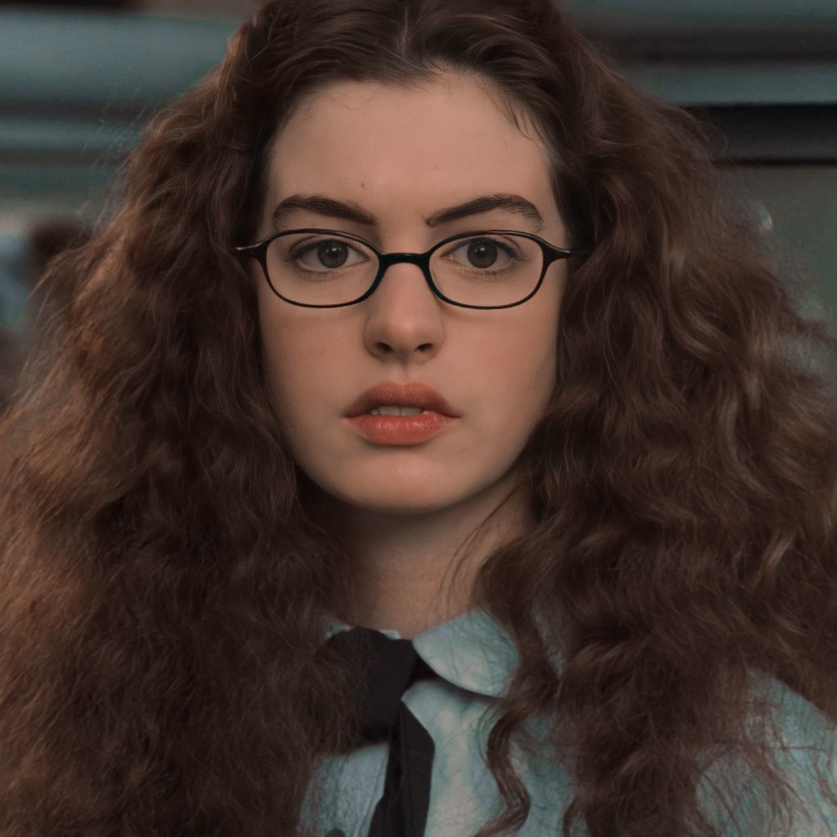 anne hathaway is shown in character as mia thermopolis from the princess diaries movie