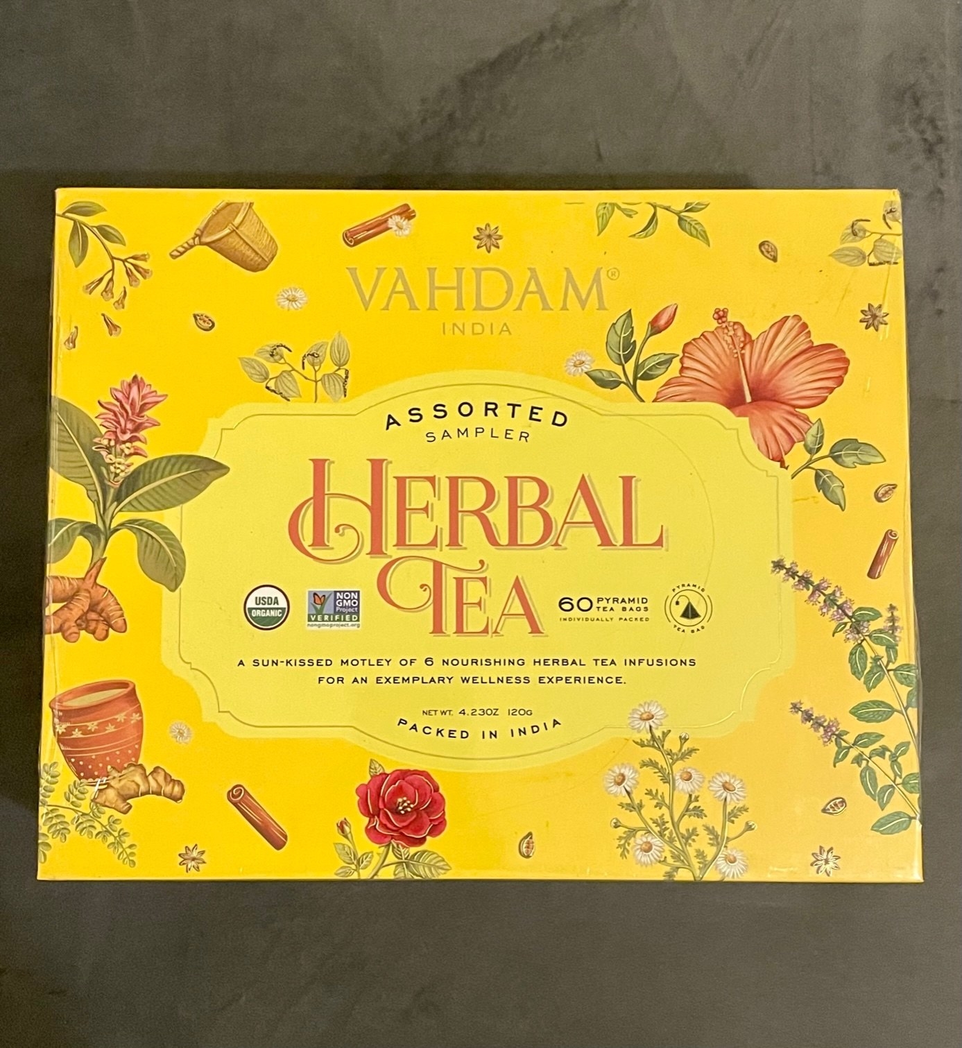 A closed yellow box of herbal tea