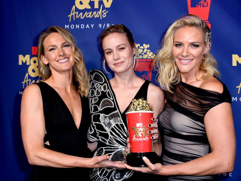 Brie, Joanna, and Renae all holding an award together