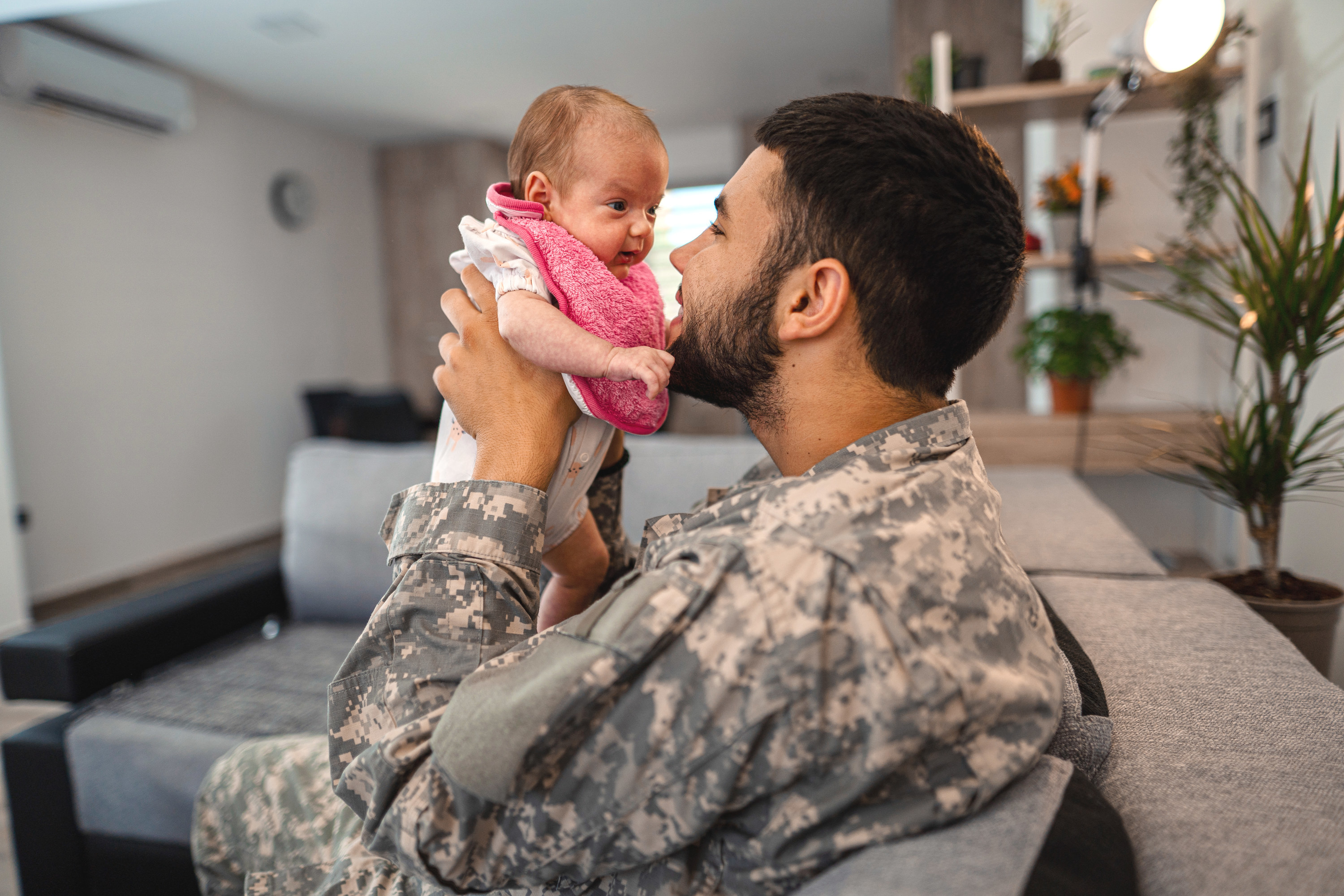 Soldier holding a baby