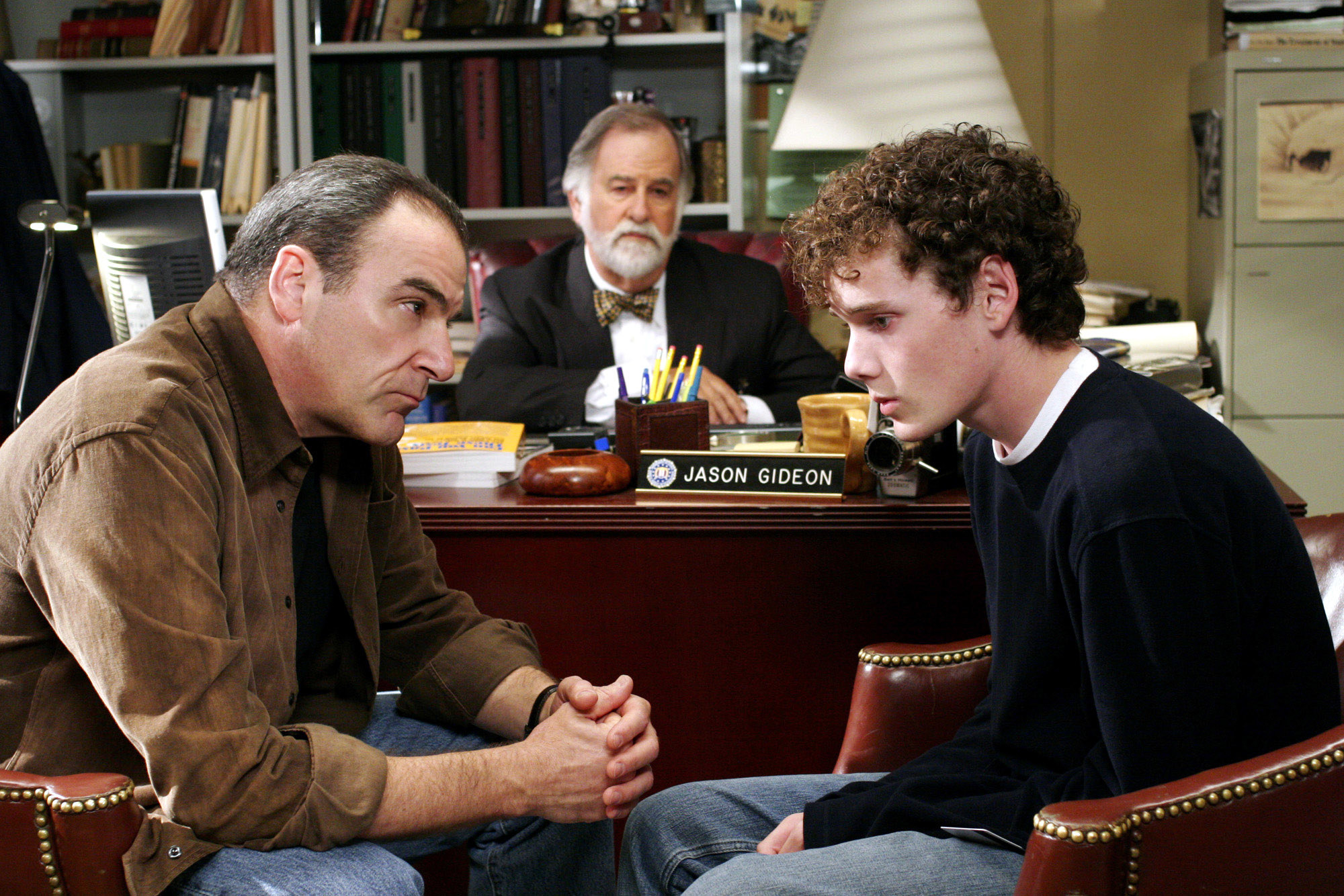 Patinkin talking to a student in the principals office