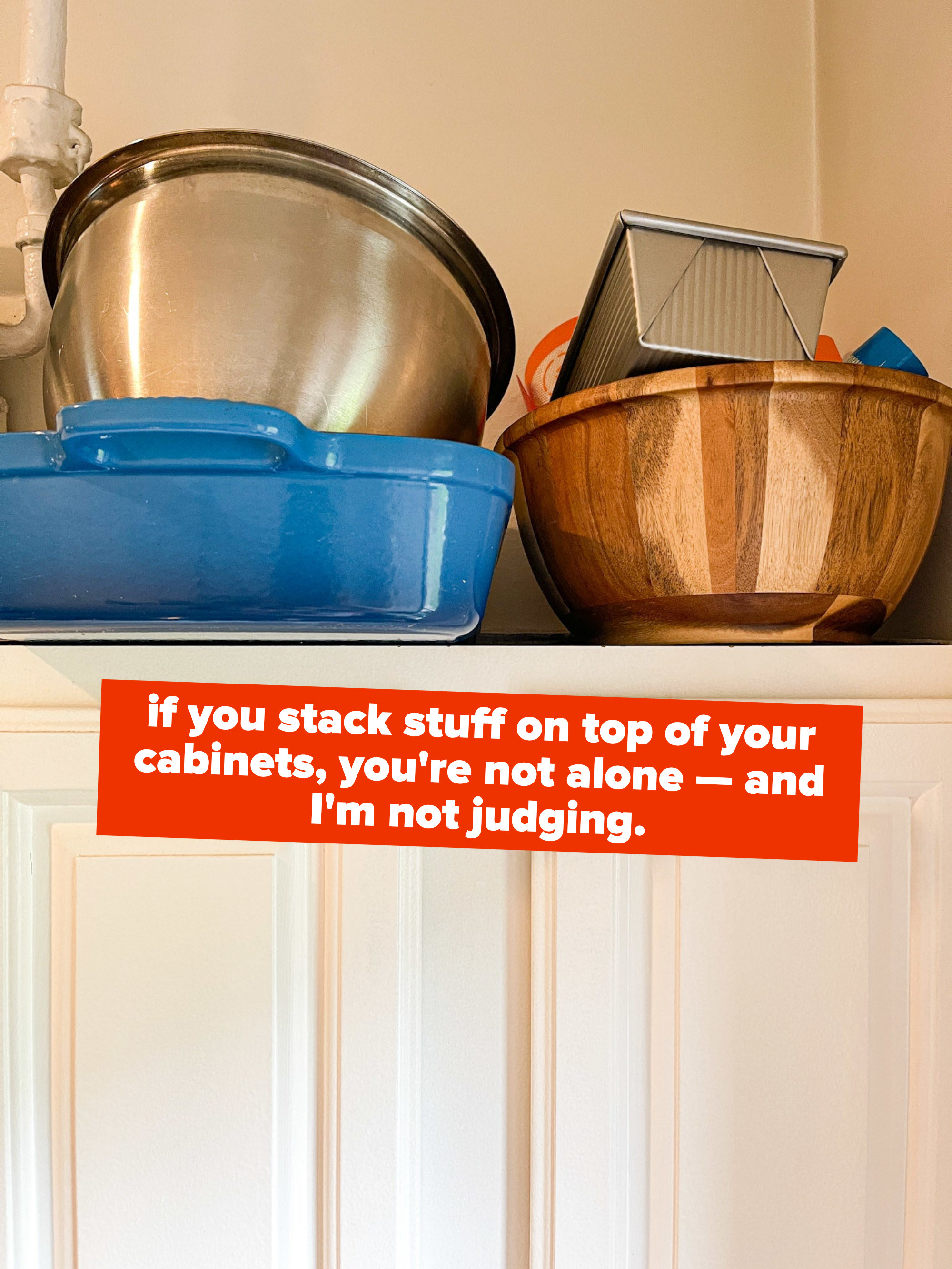 cookware stacked on cabinet