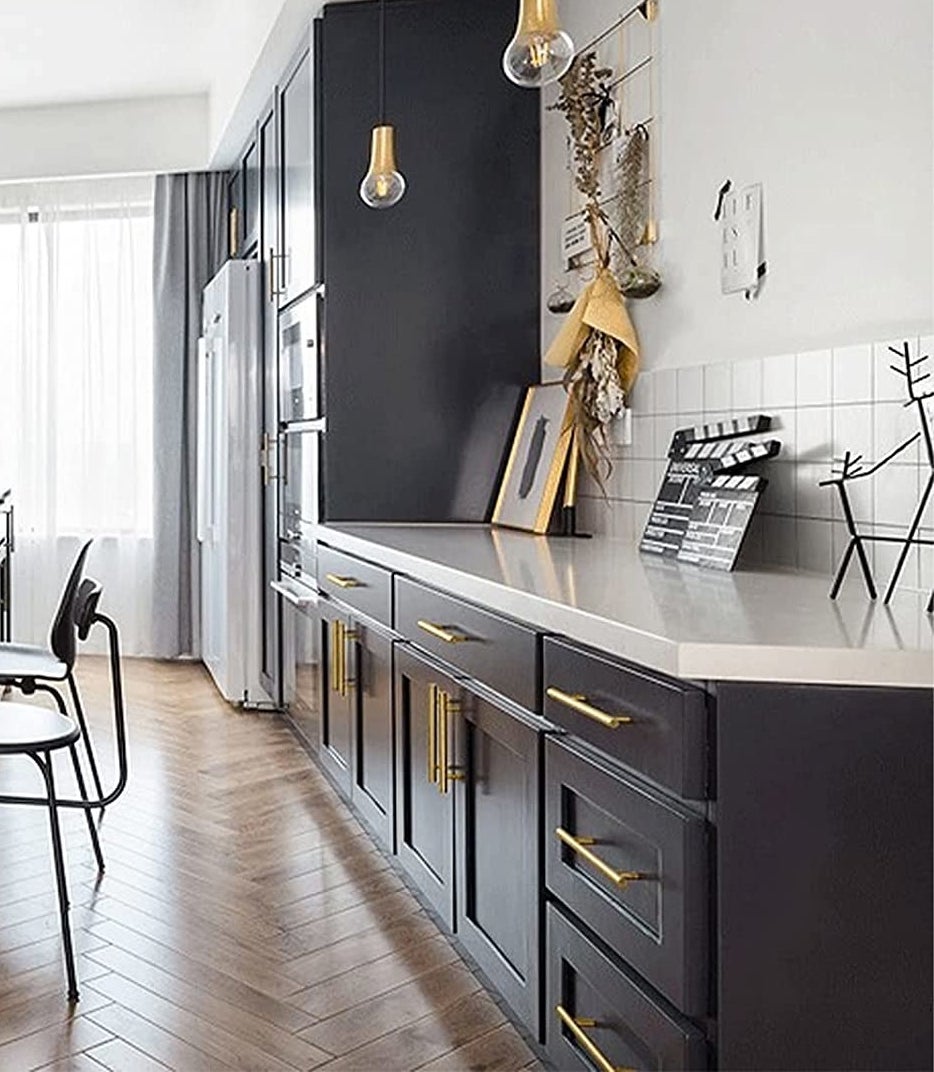 An open-space kitchen showcasing the gold handles