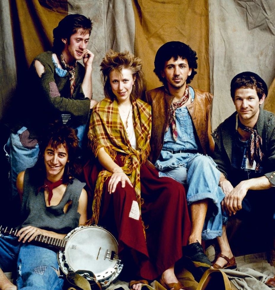 Dexys Midnight Runners posing for a portrait in 1982
