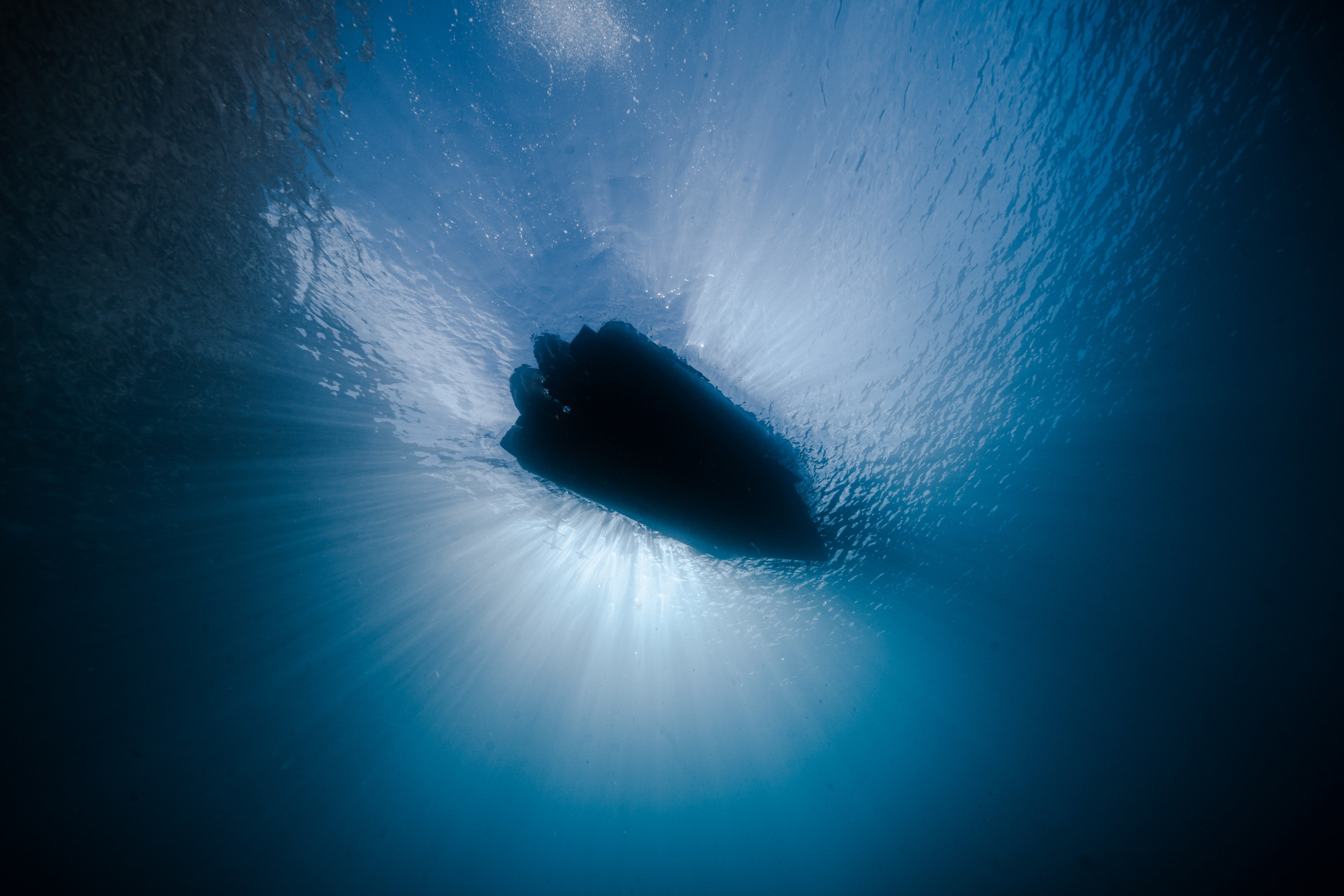 the bottom of a boat as seen from underwater
