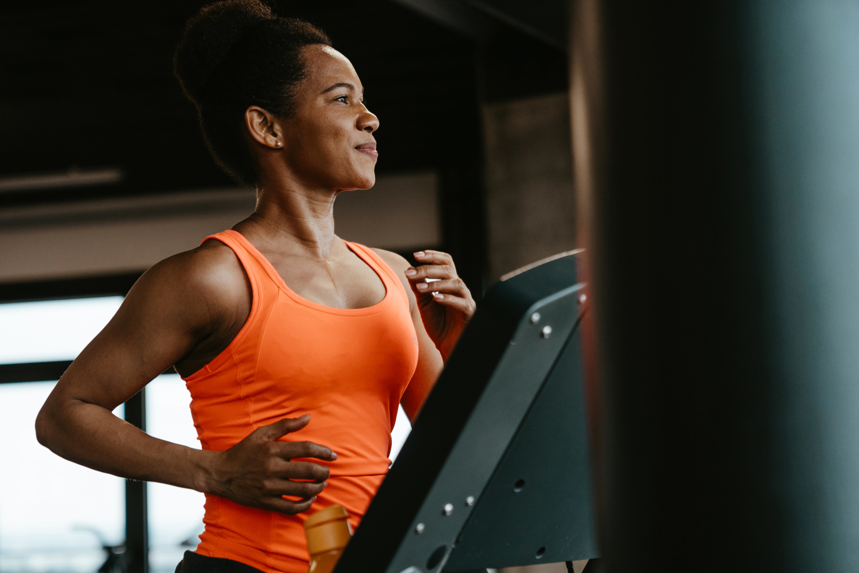 Woman running on a treadmill at the gym