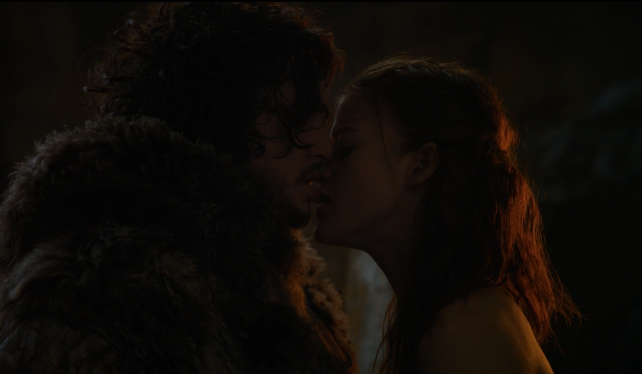 Ygritte and Jon  kissing in the cave