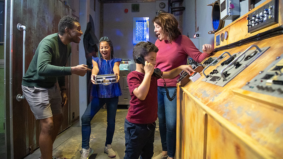 family solving puzzles in an escape room