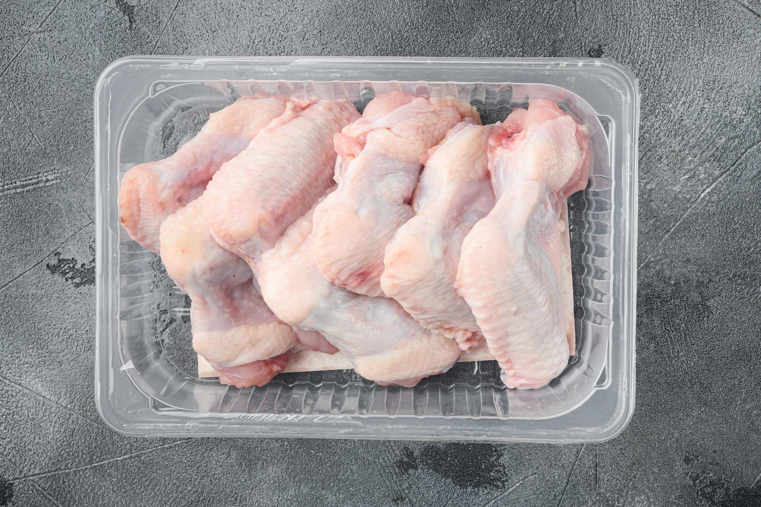 A package of raw chicken.