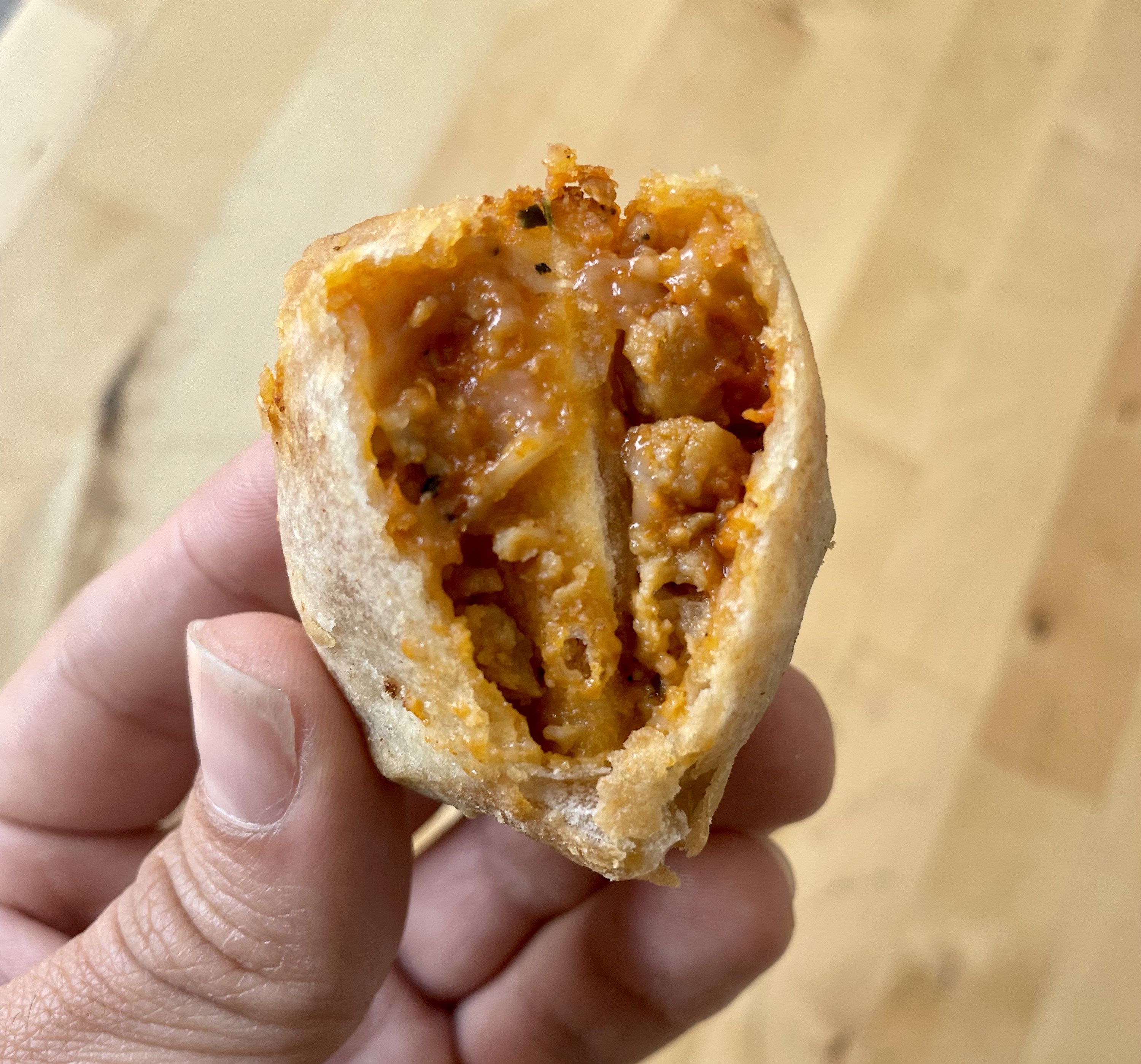The inside of the pizza sausage empanada