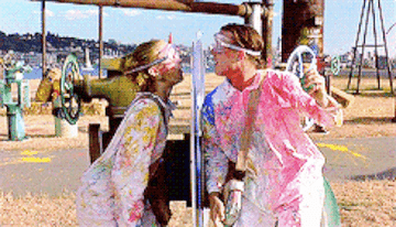 Kat and Patrick in a paintball fight