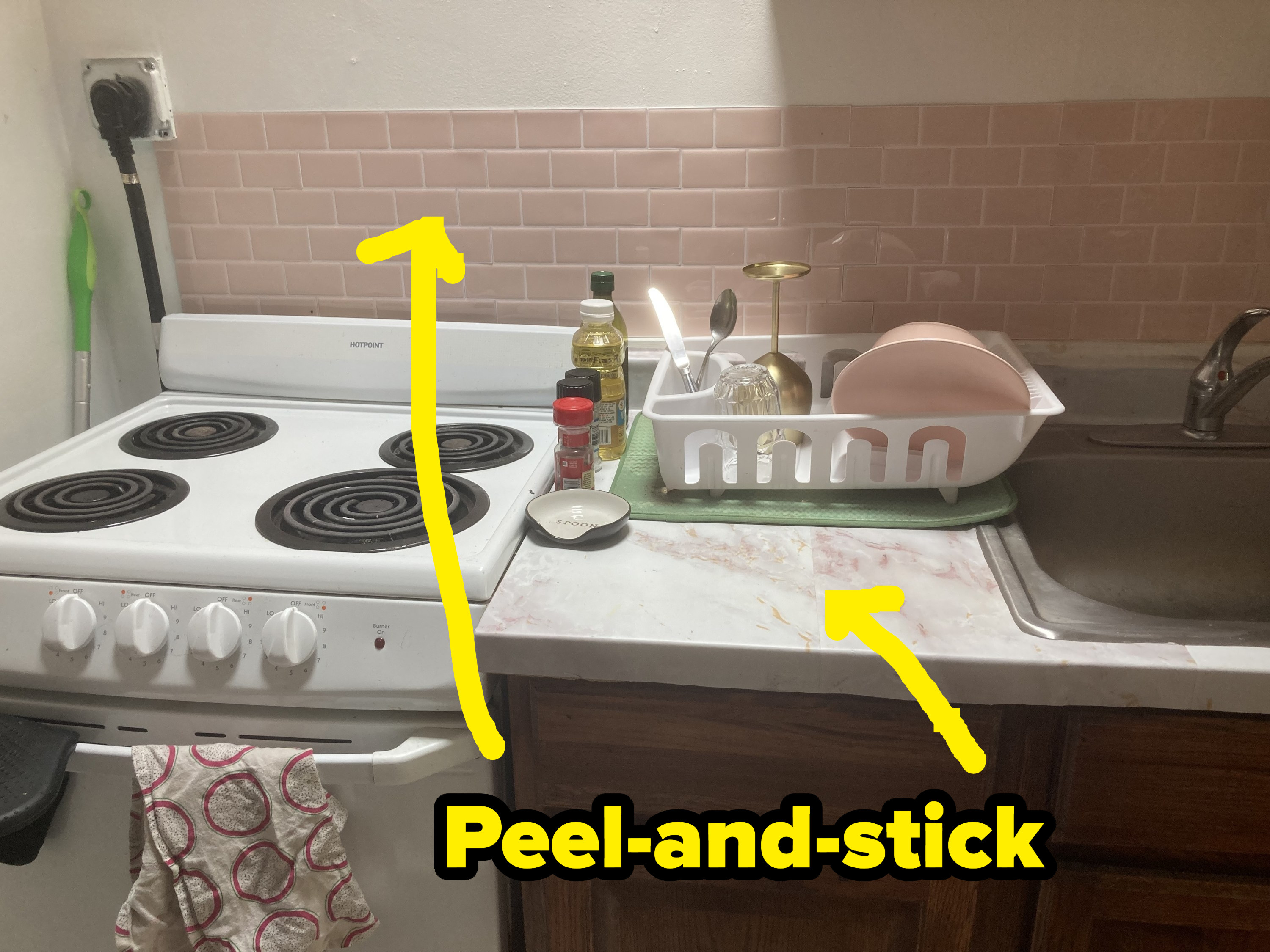 Peel-and-stick tiles over a stove.