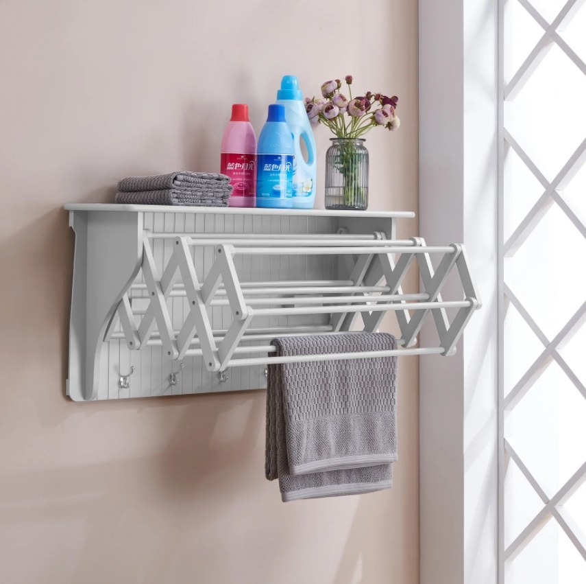 white hanging shelf with extending drying rack