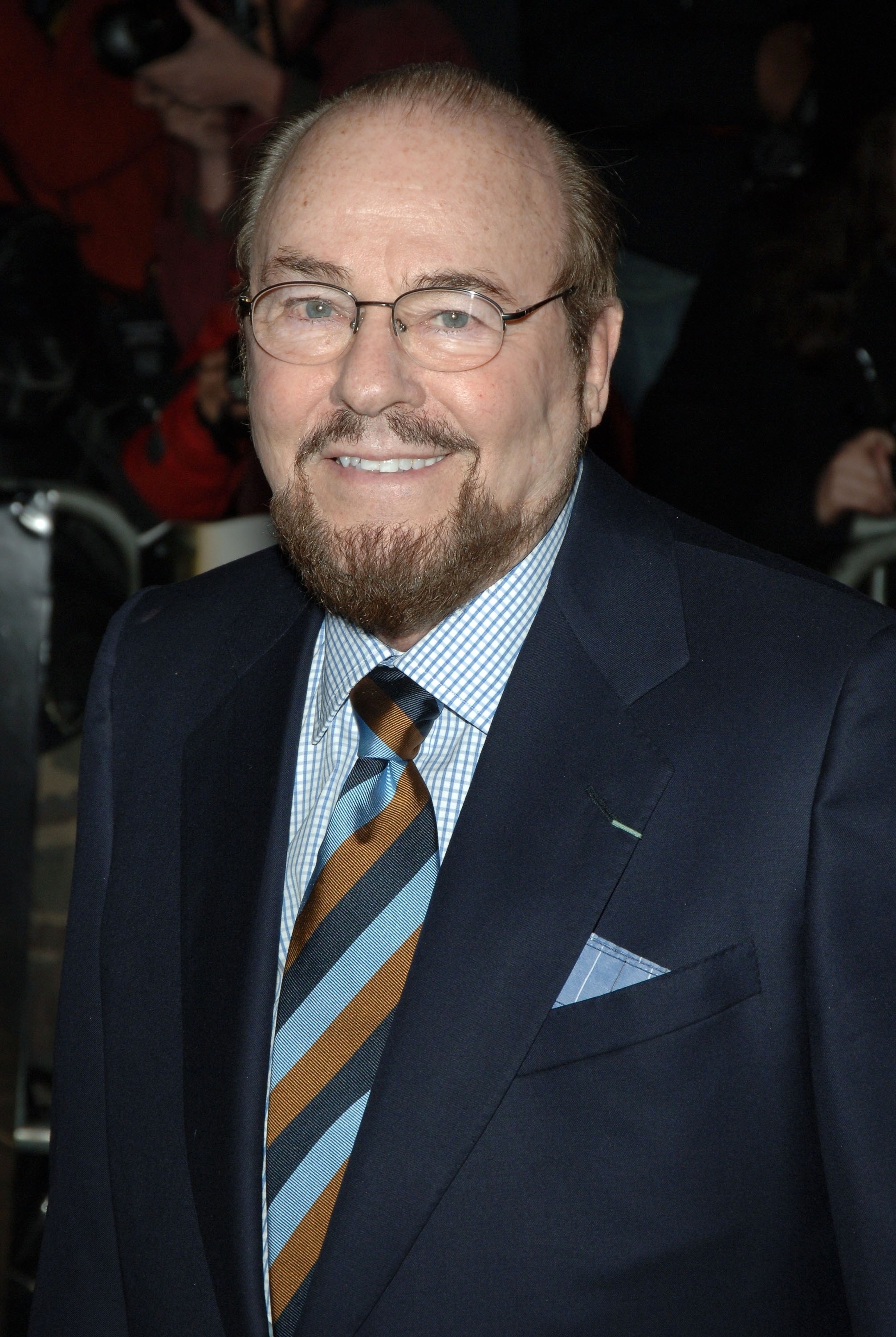 James Lipton smiling and wearing a suit