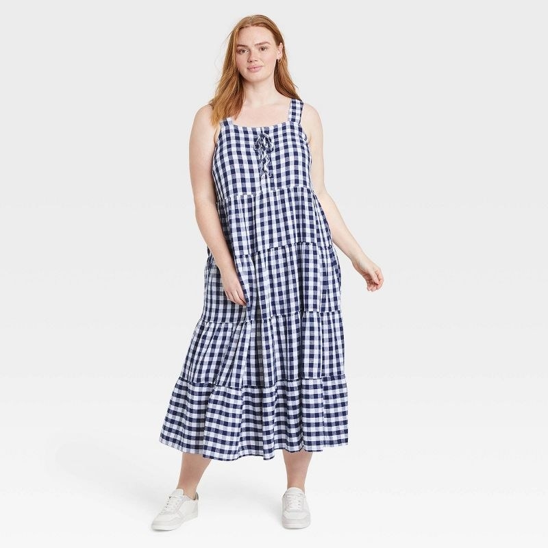 another model wearing the dress in gingham