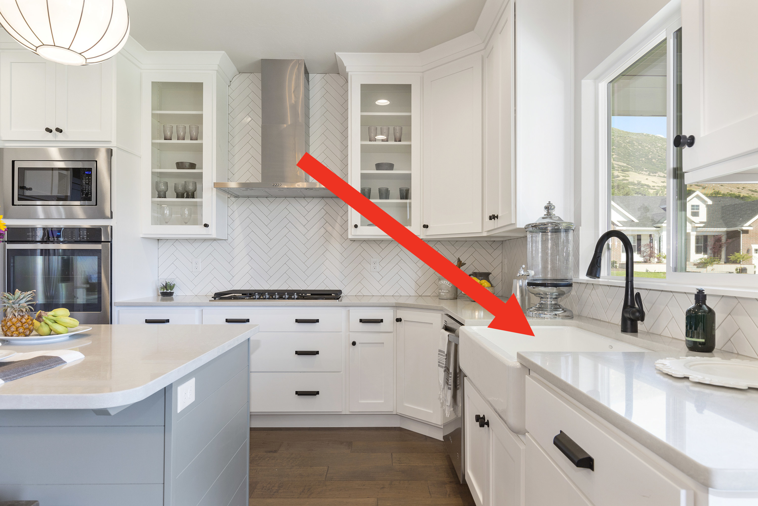 Farmhouse sink in a white kitchen