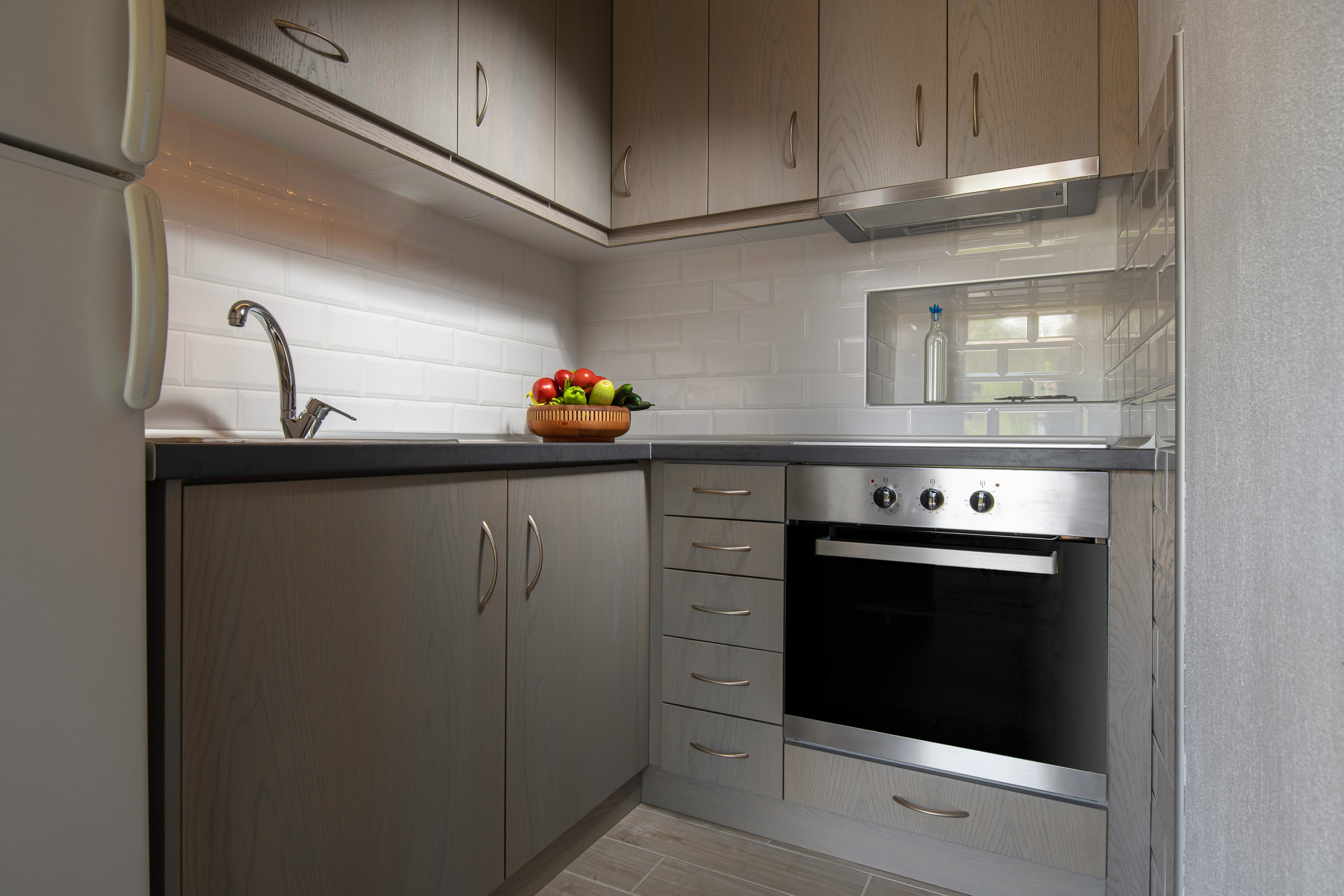 Gray kitchen with subway tile backsplash