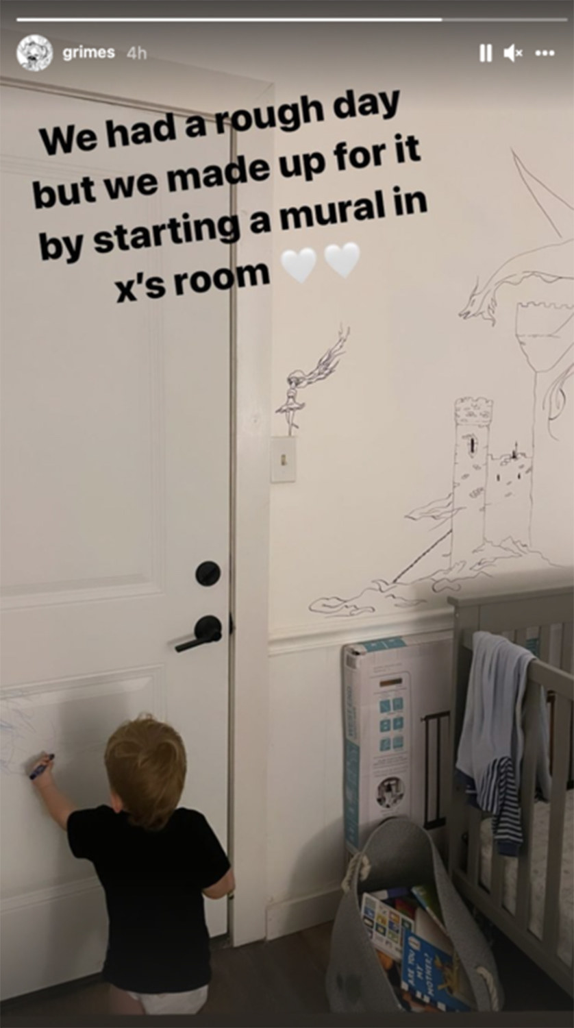 baby X drawing on the door with crayon