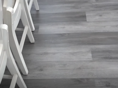 Gray vinyl flooring in a kitchen next to bar stools