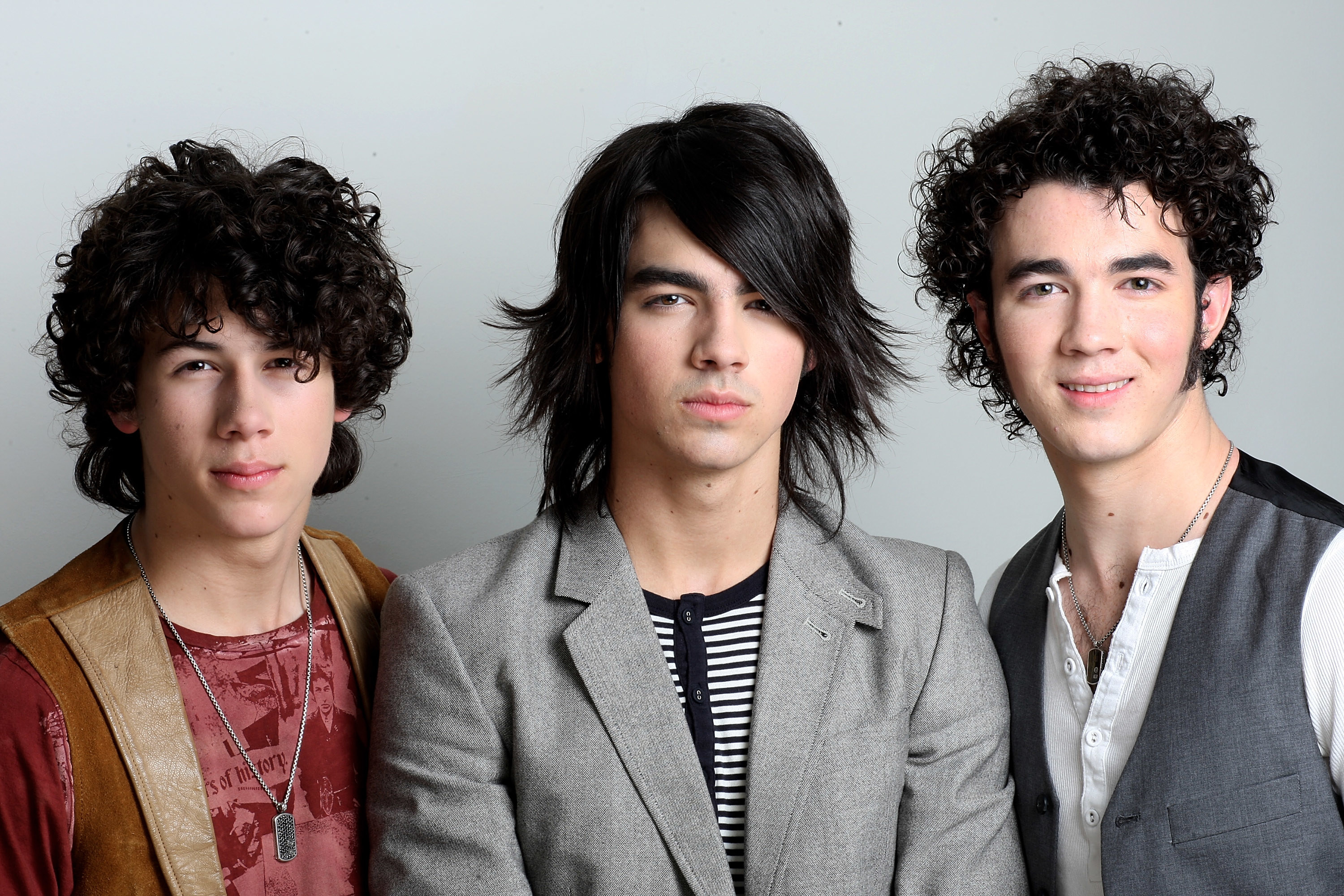 Nick, Joe and Kevin Jonas pose together for a photo a show at a Universal Records conference in 2008