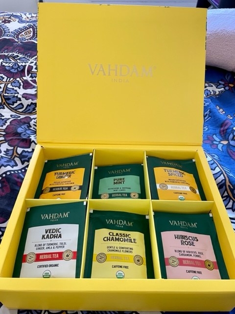 The same boxed opened showing six compartments with different tea flavors