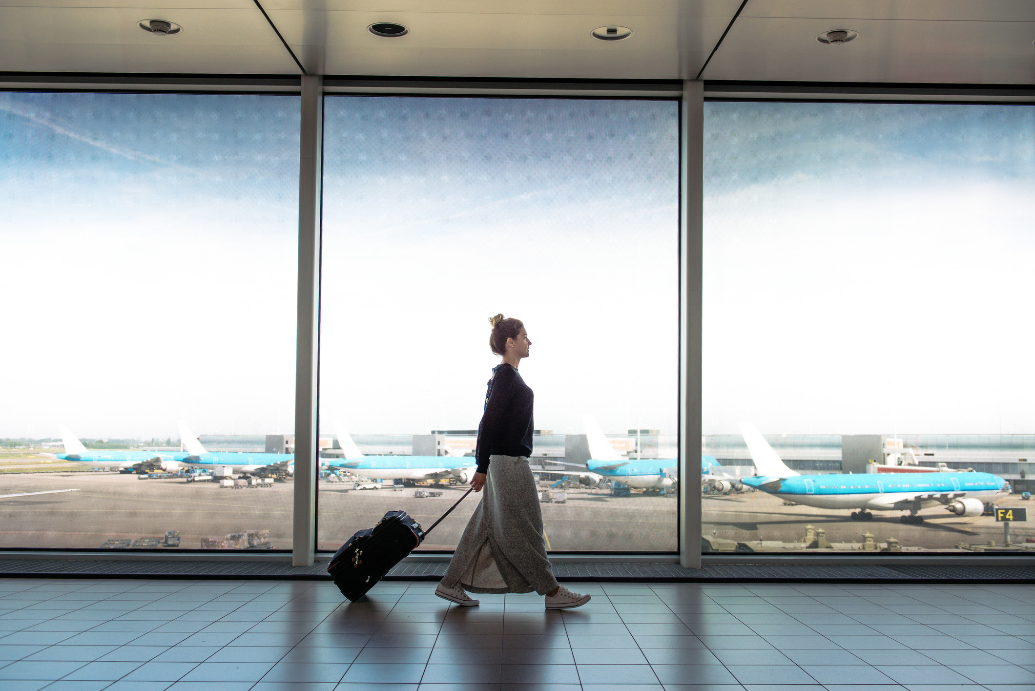 A woman walking through an airport