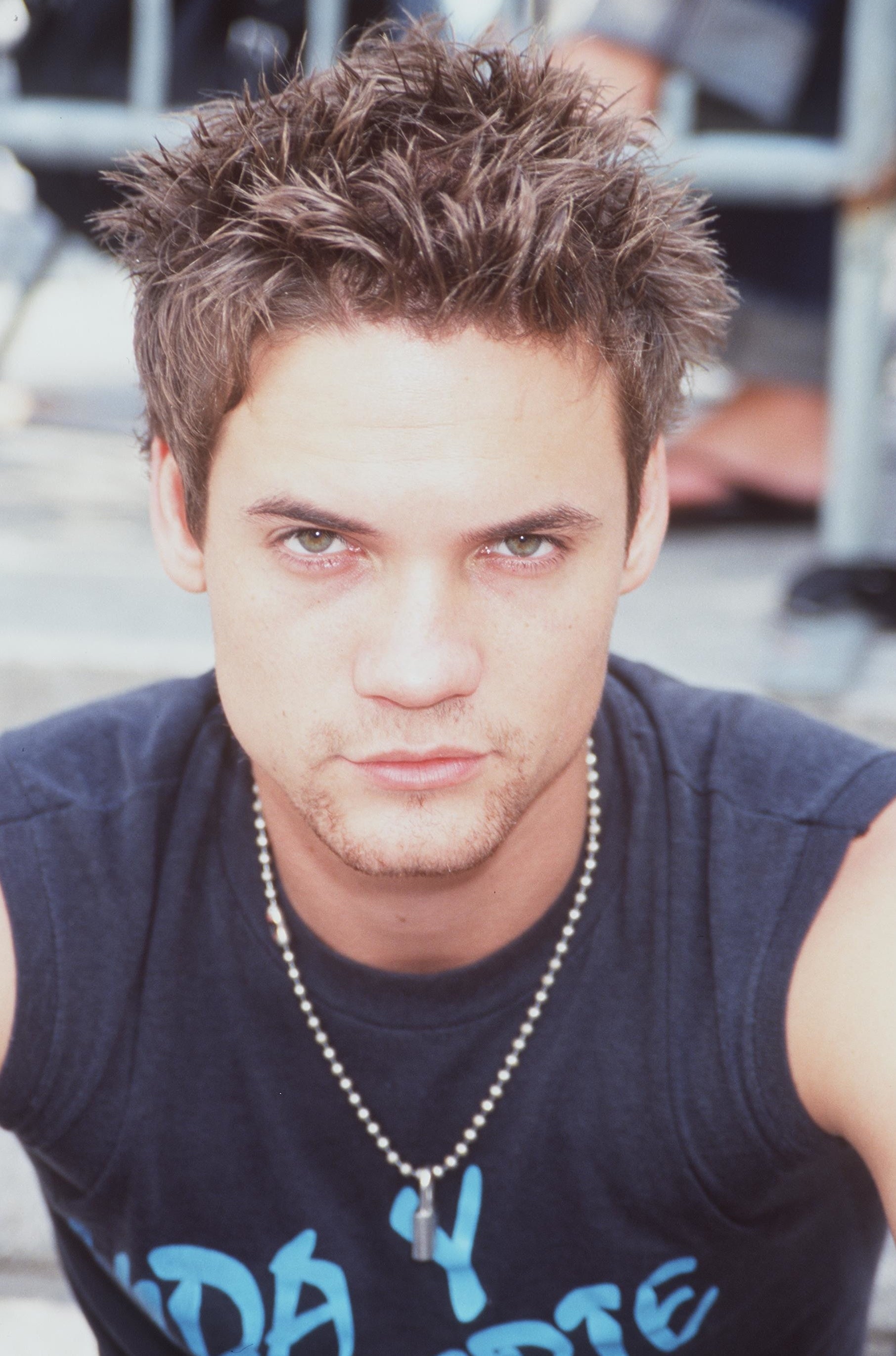 Shane West poses while sitting in at a Nautica fashion show even on September 14, 2000