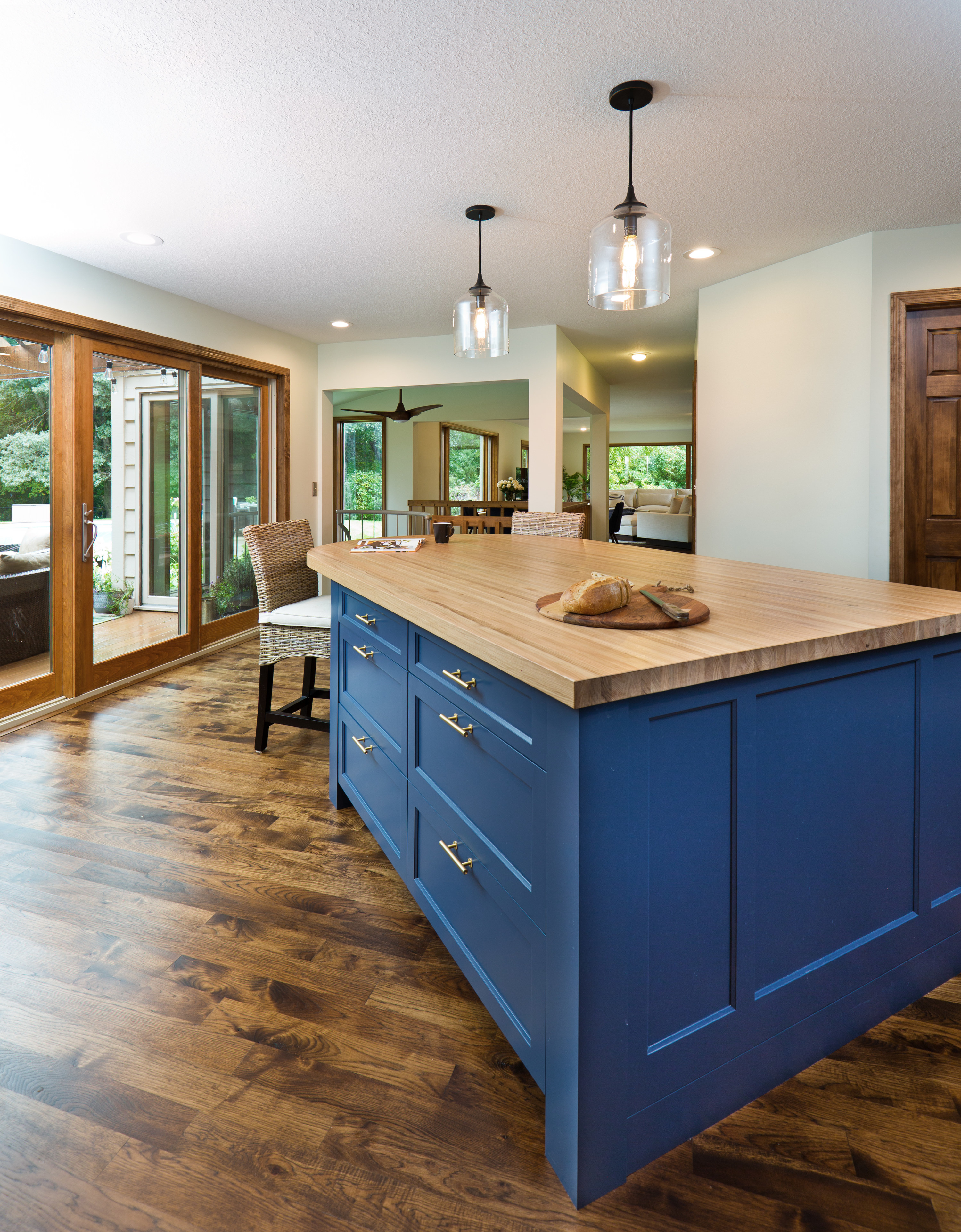 Blue cabinets in a kitchen with gold hardware