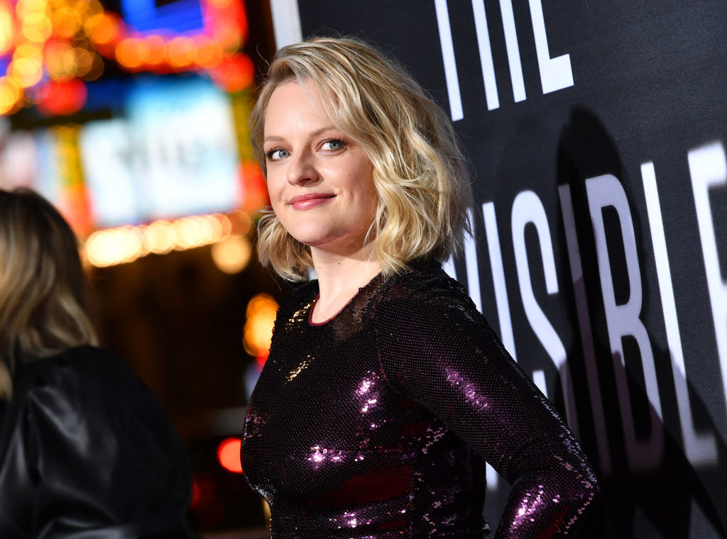 Elisabeth Moss smiles at an event