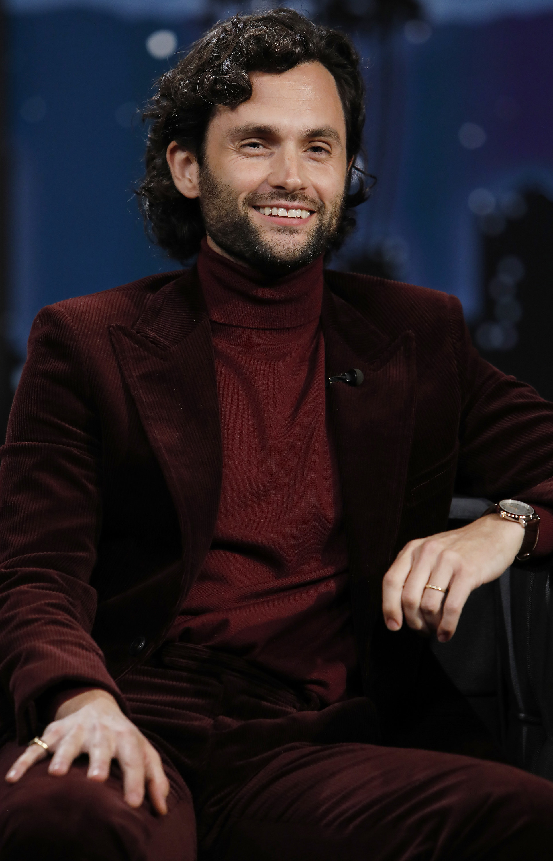 Penn Badgley smiles as he sits in as a guest on &quot;Jimmy Kimmel Live!&quot; in October 2021