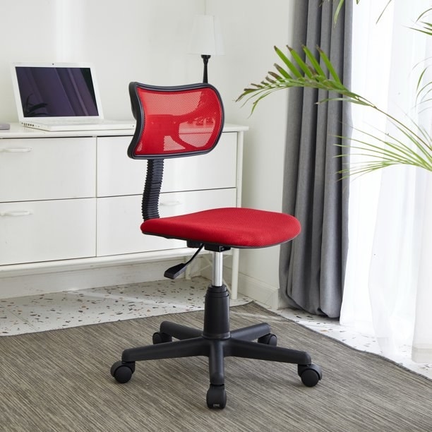 An image of a pink task chair with adjustable height and a 225-pound capacity