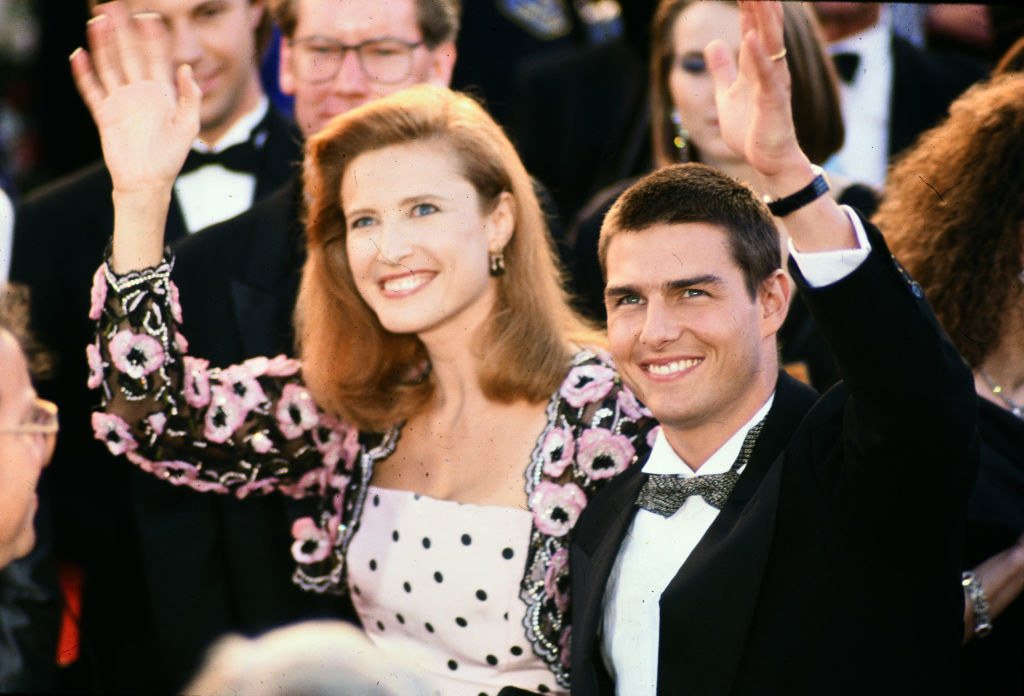 Mimi Rogers and Tom Cruise waving