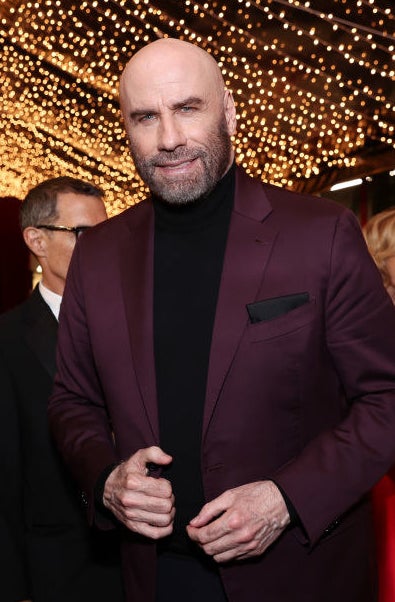 John Travolta smiles at an event