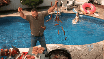 GIF of a man dropping hot dogs onto a grill in front of a pool